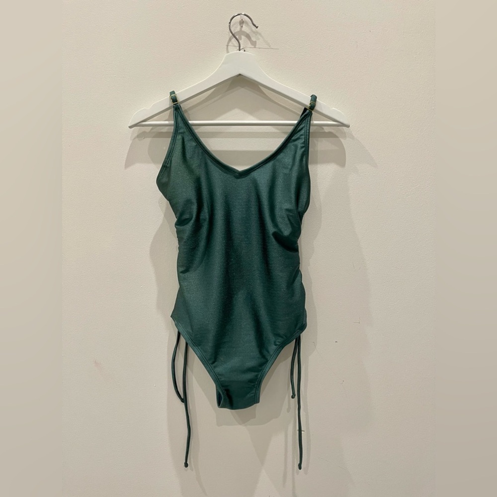 Green one piece swimsuit.